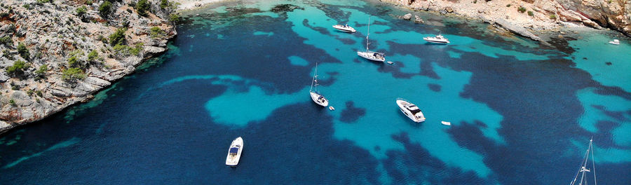 High angle view of sailboats in sea