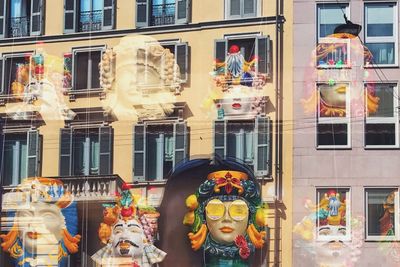 Graffiti on glass building in city