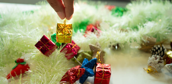 Close-up of hand holding christmas decoration