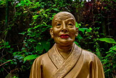 Close-up of statue against plants