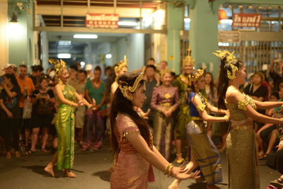 Group of people at market stall