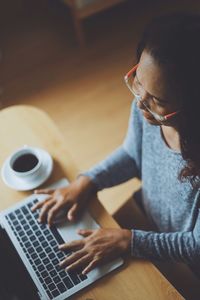 High angle view of woman using laptop