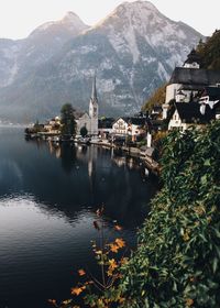 View of church by river against mountain