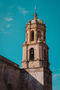 Low angle view of building against blue sky