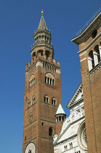 Low angle view of clock tower against sky