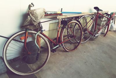 Bicycle parked against wall