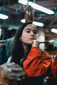 Thoughtful young woman looking away