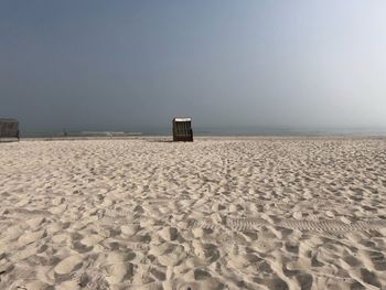 Scenic view of beach against clear sky