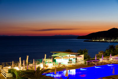 View of swimming pool at night