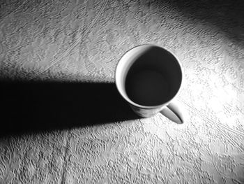 Close-up of coffee cup on table