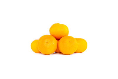 Close-up of oranges against white background