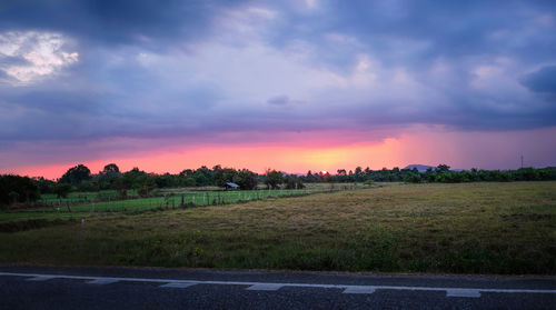 Scenic view of field against sky during sunset