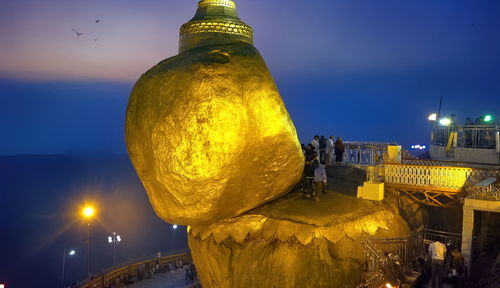 Panoramic view of illuminated buildings against sky at night,unseen of myanmar