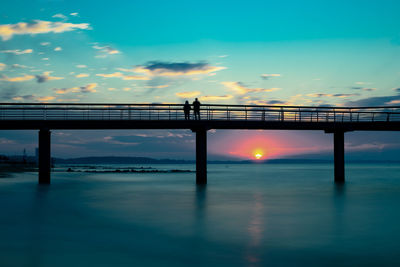 Pier over sea against sky