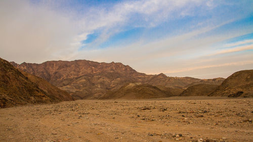 Scenic view of landscape and mountains at sunset