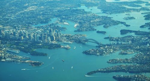 Aerial view of sea amidst cityscape