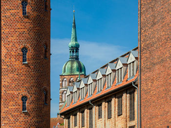 Low angle view of building against blue sky