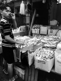 Man having food at market stall