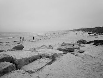 Scenic view of beach against clear sky