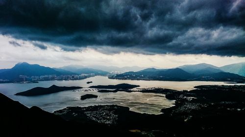 Scenic view of mountains against cloudy sky