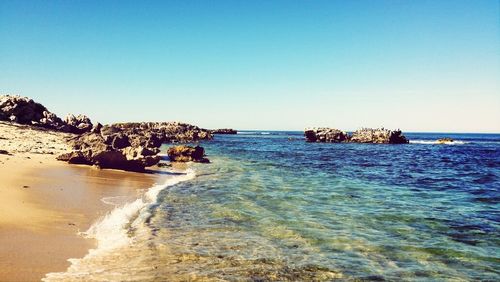 Scenic view of sea against blue sky