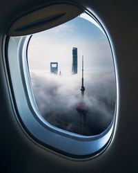 Modern skyscrapers seen through airplane window