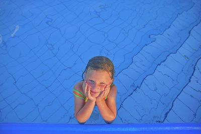 Cute little girl in the public swimming pool. portrait of little cute girl in the swimming pool