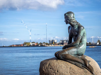 Low angle view of statue against sky of little mermaid.