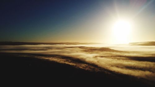 Sun shining through clouds