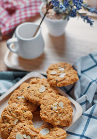 High angle view of coffee and cookies on table