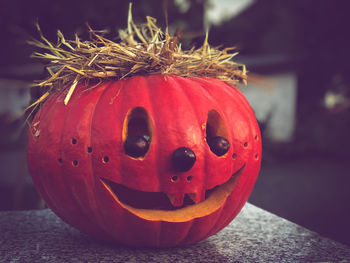 Close-up of pumpkin on red leaf