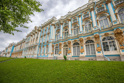 Low angle view of building against cloudy sky