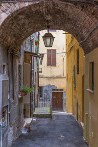 Empty alley amidst buildings