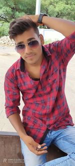 Portrait of young man using mobile phone