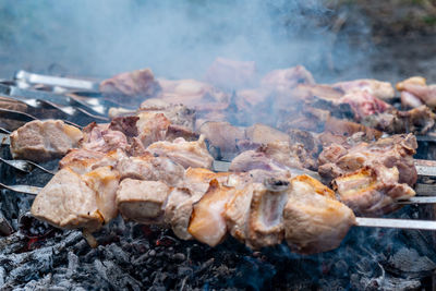 Close-up of meat on barbecue grill