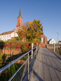 View of trees and building against sky