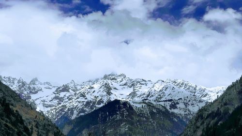 Scenic view of snowcapped mountains against sky