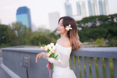 Young woman holding bouquet