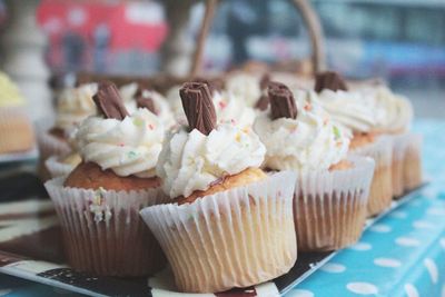 Close-up of cupcakes for sale in bakery