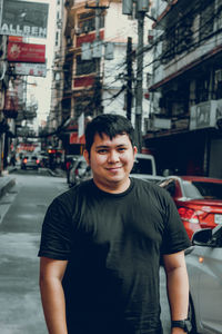 A young man on the street of chinatown.