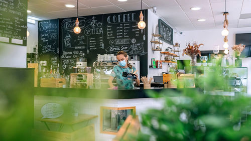 People working in cafe at store
