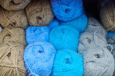 Multicolored yarn balls in knitting shop center. a lot of color yarn for knitting. colorful