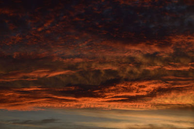 Low angle view of dramatic sky during sunset