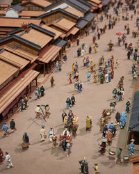 High angle view of model depicting people and buildings of historic japan