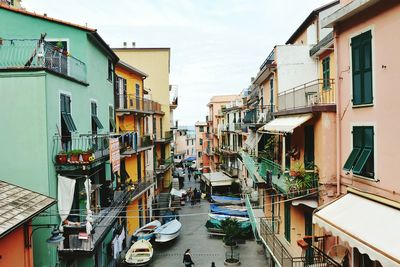 View of houses in city against sky