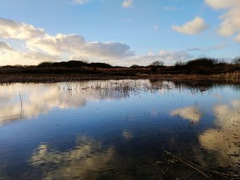 Scenic view of lake against sky