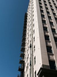 Low angle view of skyscraper against clear sky