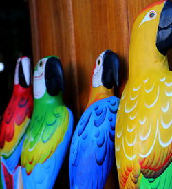 Close-up of wooden birds