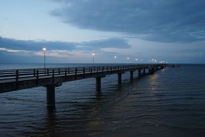 Pier over sea against sky