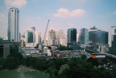 Modern buildings against sky in city